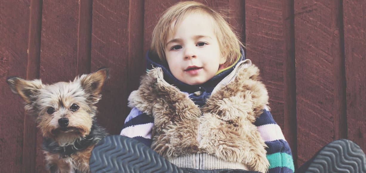 Kid and Dog Lean on Wall Kid and dog lean on the wall