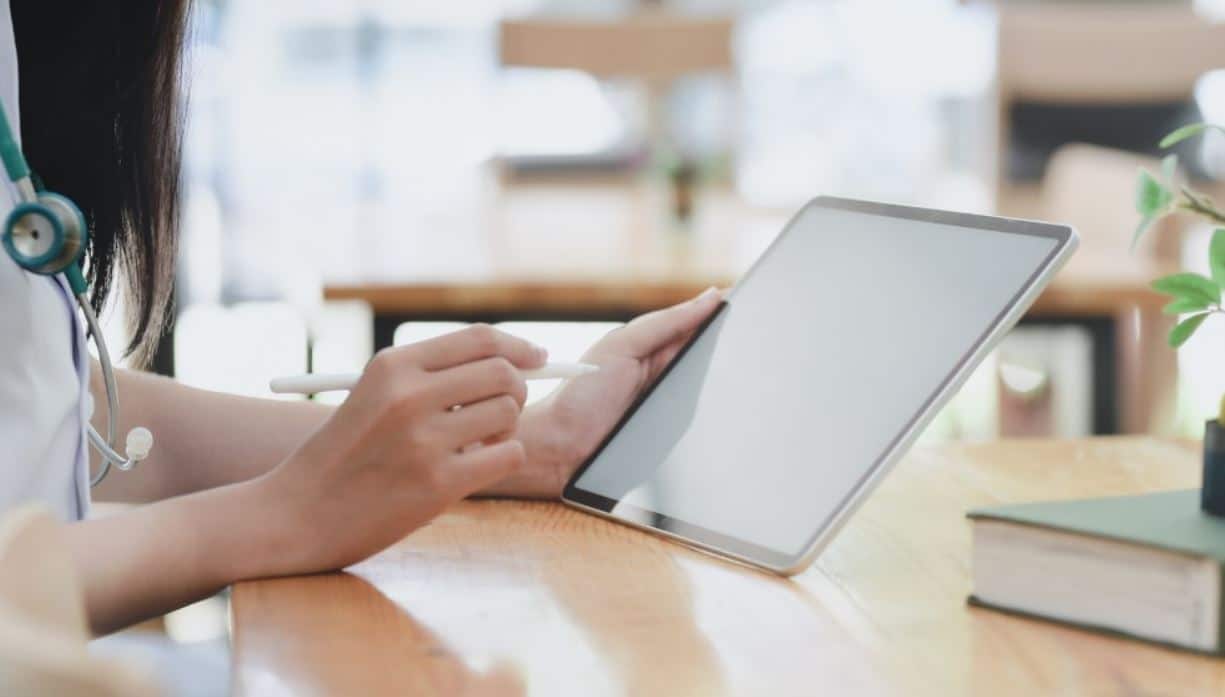 Tablet Searching Woman searching for telemedicine