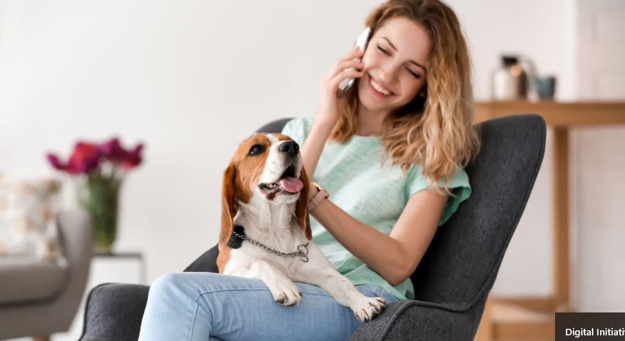 Woman and Beagle Woman talking on the phone with Beagle